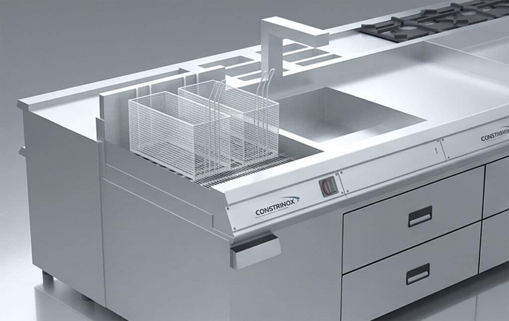 Perspectiva em 3D focada nas fritadeiras de cesto duplo e na cuba de inox de um fogão industrial de alta performance.